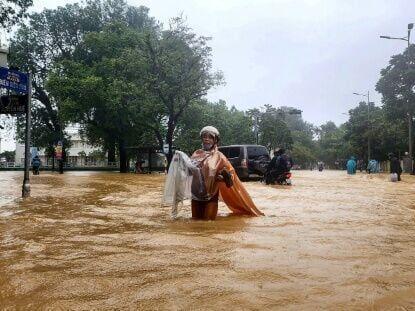 Record Vietnam rains kill four and flood 100,000 homes